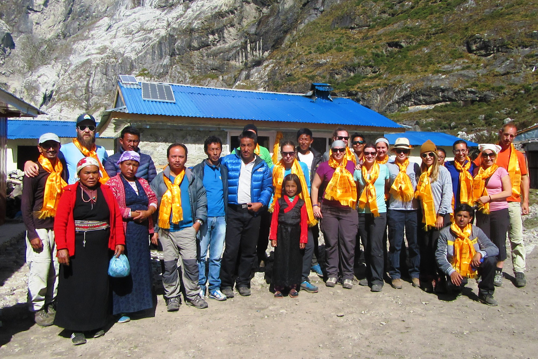 A group of Intrepid travellers with locals in Langtang, Nepal