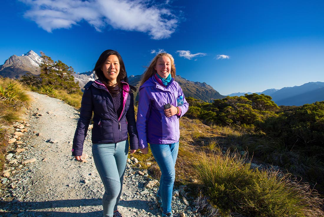 Travellers hiking Routeburn Track, New Zealand